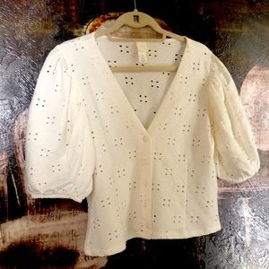 Cotton eyelet knit puff sleeve blouse.
